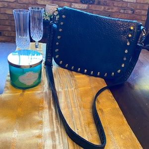 Urban Expressions Black bag with brass accents.